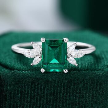 Vintage Emerald Cut Emerald Engagement Ring In White Gold