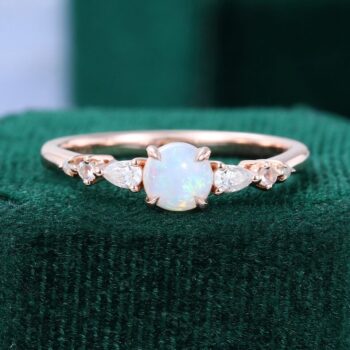 Asteria | Round Cut Opal Dainty Engagement Ring with Trio Side Stones