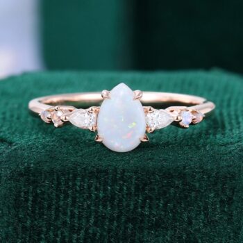 Asteria | Pear Cut Opal Dainty Engagement Ring with Trio Side Stones