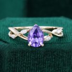 Eternal Embrace | Pear Cut Purple Sapphire Engagement Ring with Marquise Accented Split Shank