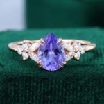 Pear Shaped Tanzanite with Moissanite Blossom Engagement Ring Double Claws Set