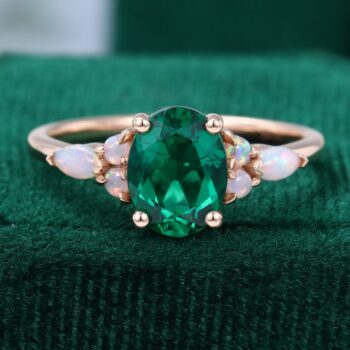 Oval Cut Emerald Engagement Ring With Opal Side Stones
