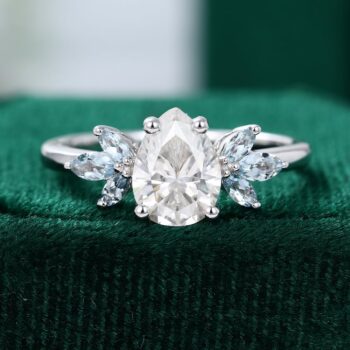Pear Shaped Moissanite With Aquamarine Wings Engagement Ring